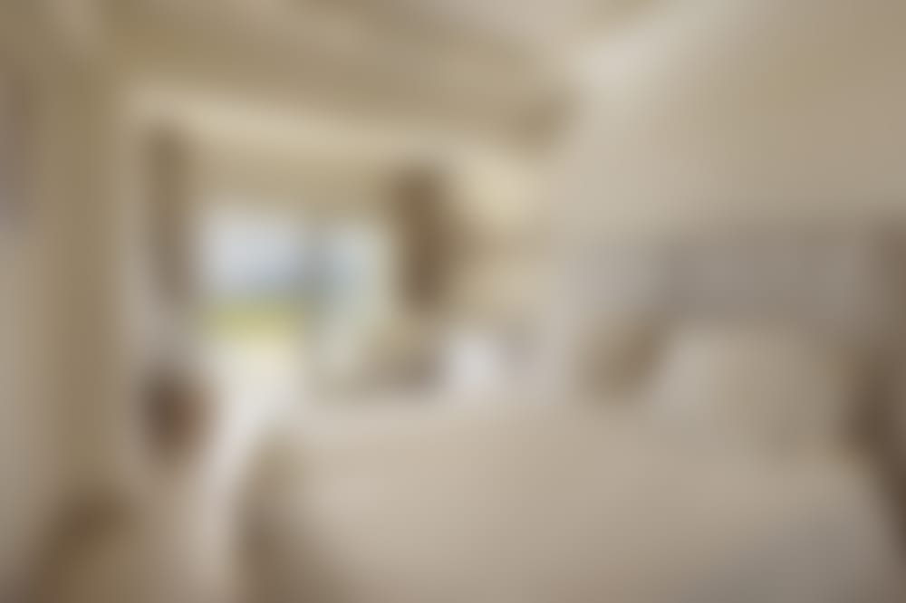 One of three double-twin bedrooms on the lower floor. (Bedroom 4)